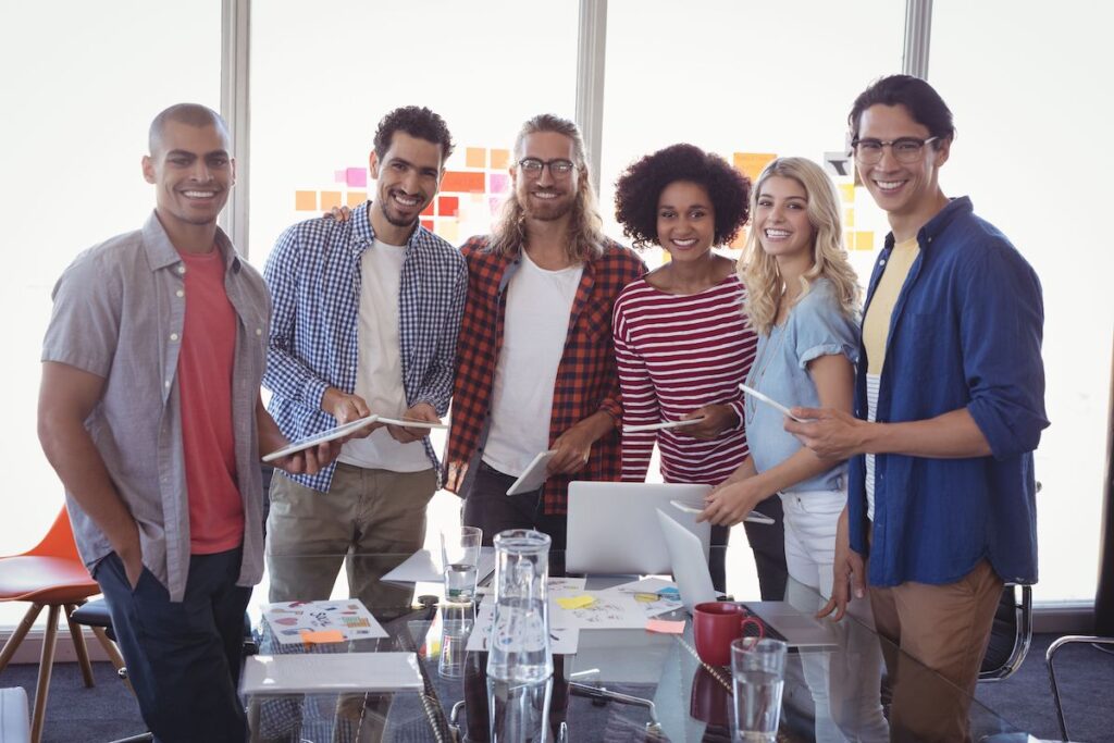 MBA team standing at conference table