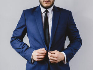 Man in blue suit getting ready